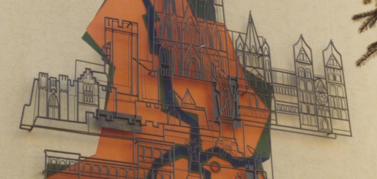 Vor 40 Jahren verstarb Ehrenbürger Ernst Wagner Großes Wandkunstwerk an einer hellen Gebäudefassade. Die Gestaltung zeigt stilisierte Umrisse mehrerer historischer Bauwerke und eines Denkmals, kombiniert mit orangefarbenen und grünen Flächen. Im unteren Bereich ist der Schriftzug „Ernst Wagner“ zu erkennen. Vor der Wand ragen die Zweige eines Strauchs ins Bild.
